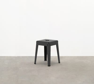 The Good One Stool is an industrial style cafe stool prized for its industrial aesthetic and durability within outdoor contexts.