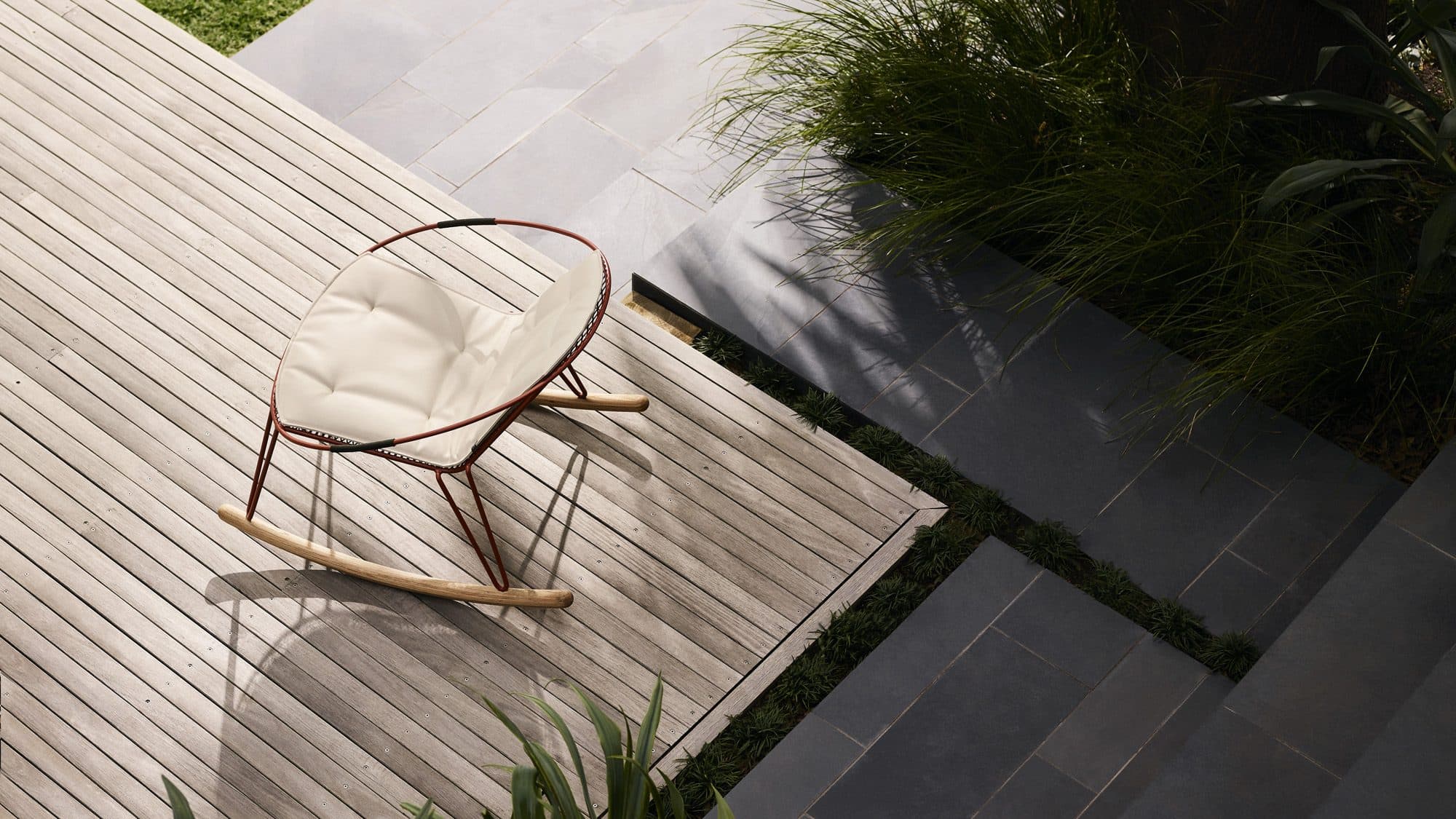 the Volley Rocker - a modern outdoor rocking chair with a distinct mid-century modern vibe designed by Adam Goodrum.