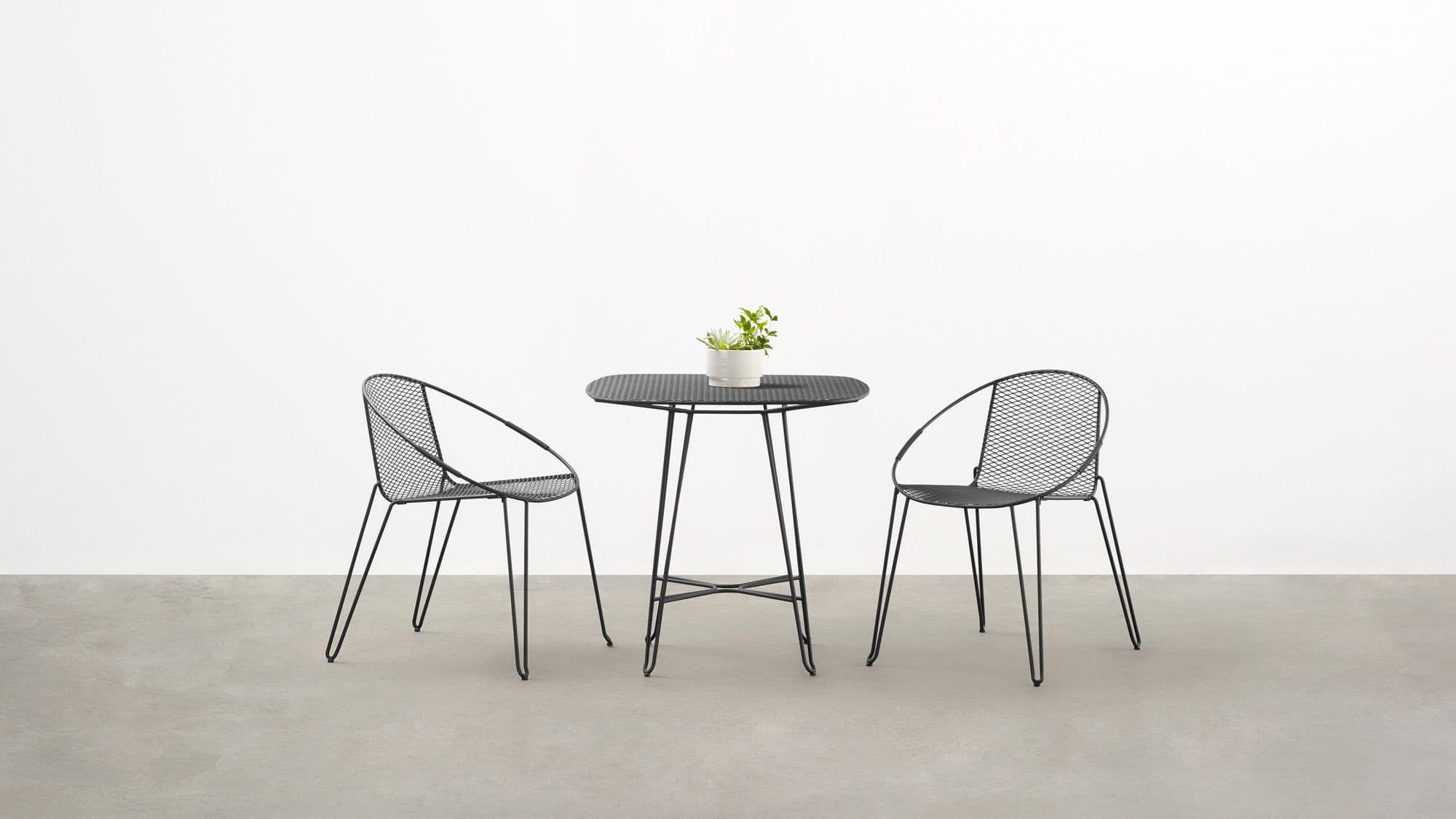 the Volley Chair - a modern outdoor dining chair with a distinct mid-century modern vibe designed by Adam Goodrum.
