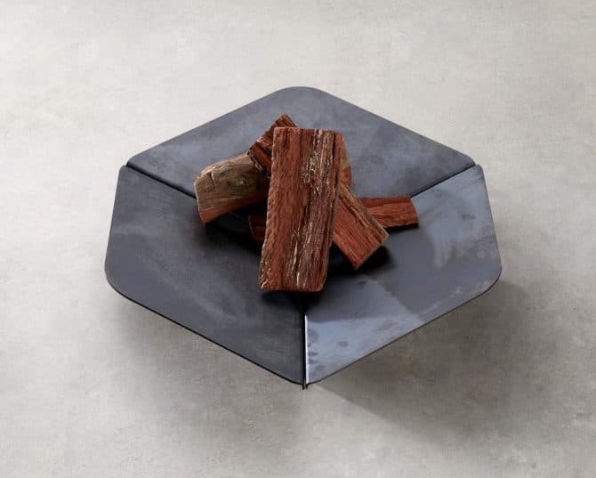 The Element Fire Pit designed by Adam Goodrum is a stylish modern fire pit that makes a striking, architectural-inspired statement.