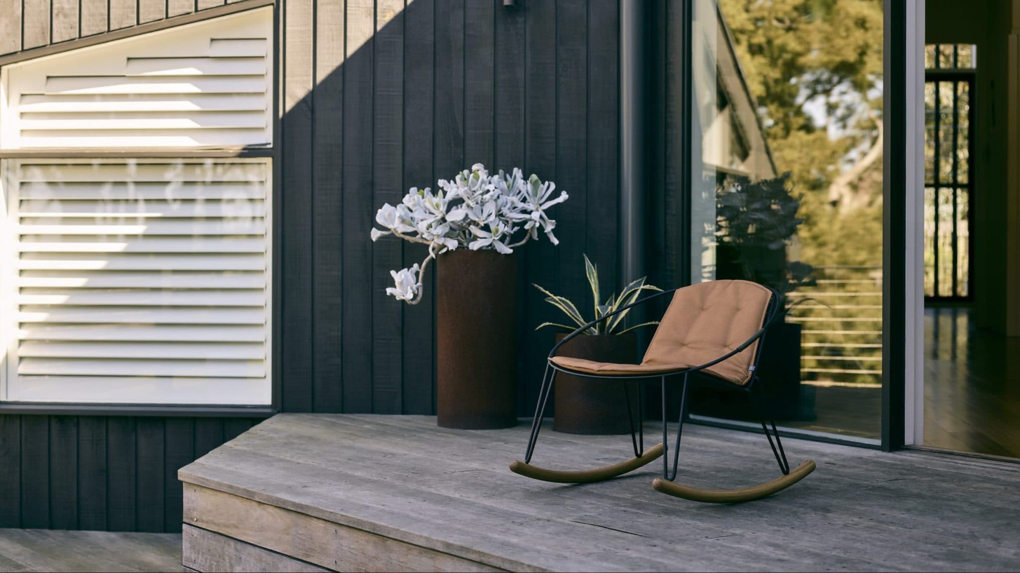 the Volley Rocker - a modern outdoor rocking chair with a distinct mid-century modern vibe designed by Adam Goodrum.