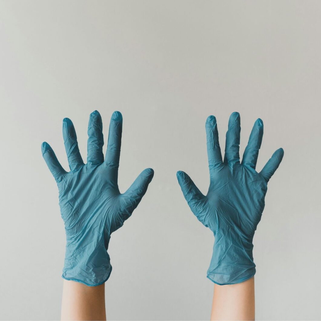 hands with cleaning gloves