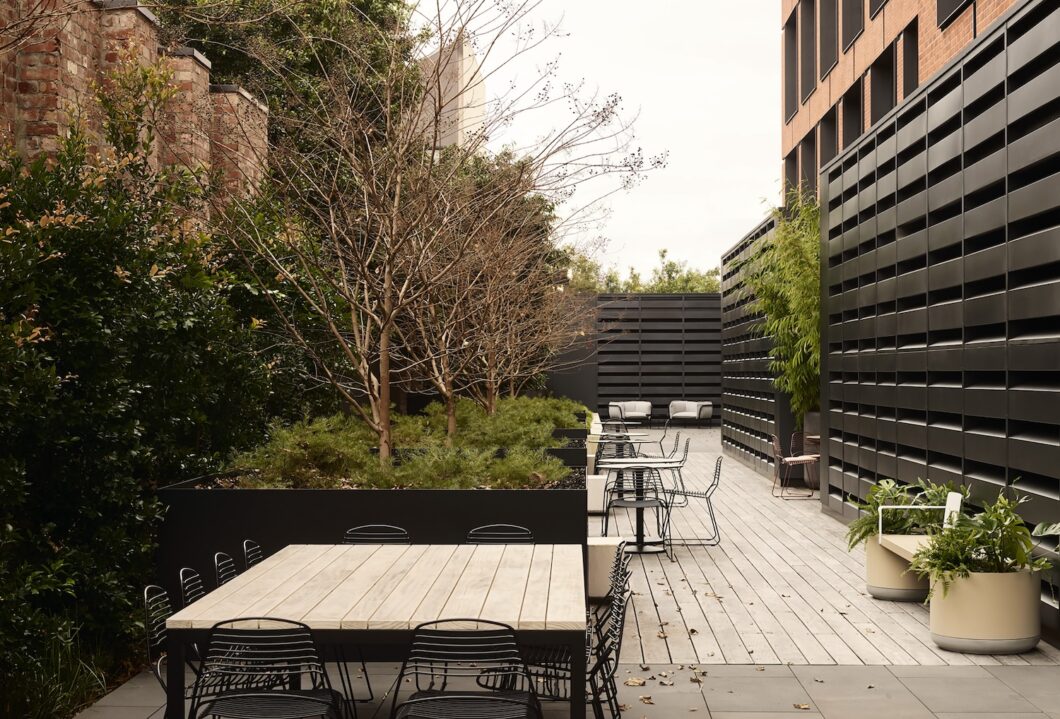 SEEK workplace rooftop by HASSELL featuring Jak Chairs and Xylem planters