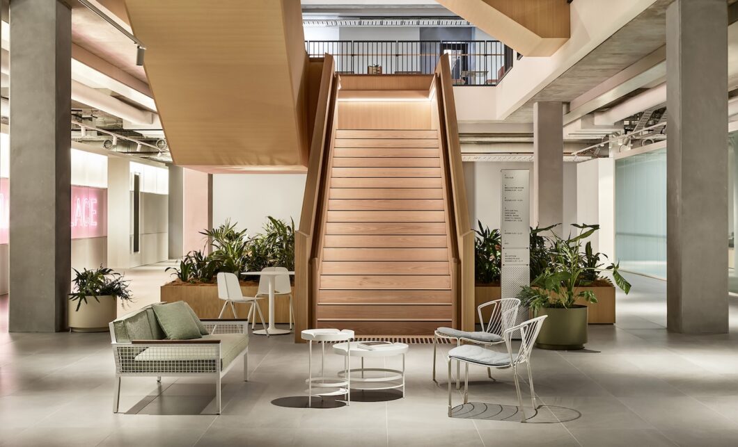 SEEK workplace by HASSELL interior lobby staircase featuring Breeze Lounge, Tidal Lounger, Seam Chair and Lily Tray Table