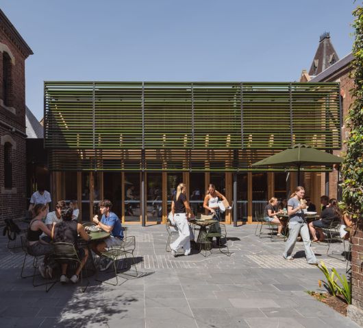 Tait Jak Chairs and Jil tables in the courtyard of Trinity College Dining Precinct by Hayball