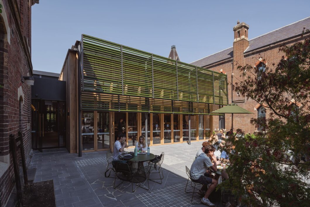 Jak Chairs and Jill table in courtyard of Trinity College, expansion designed by Hayball